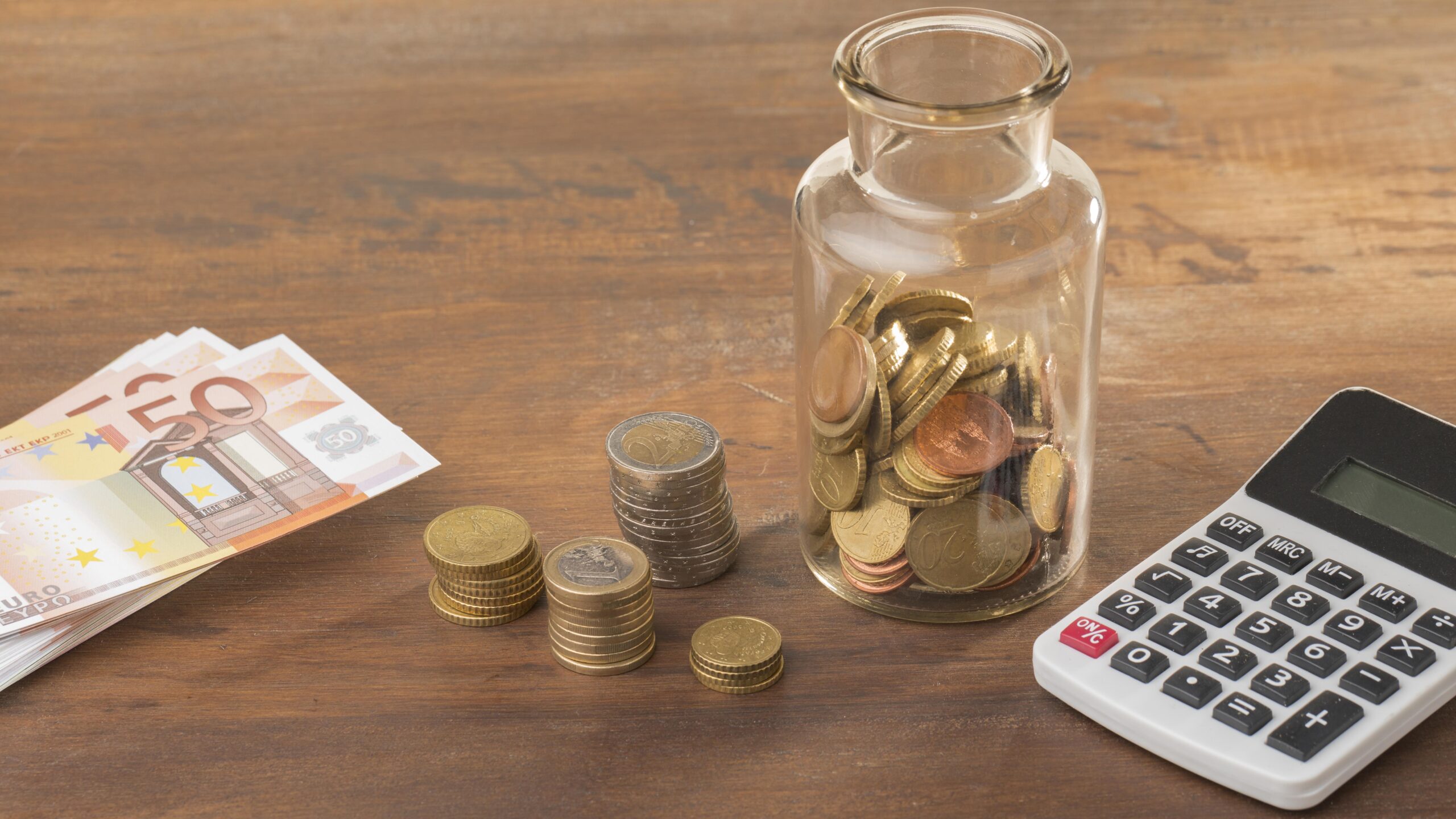 economy savings jar with calculator scaled